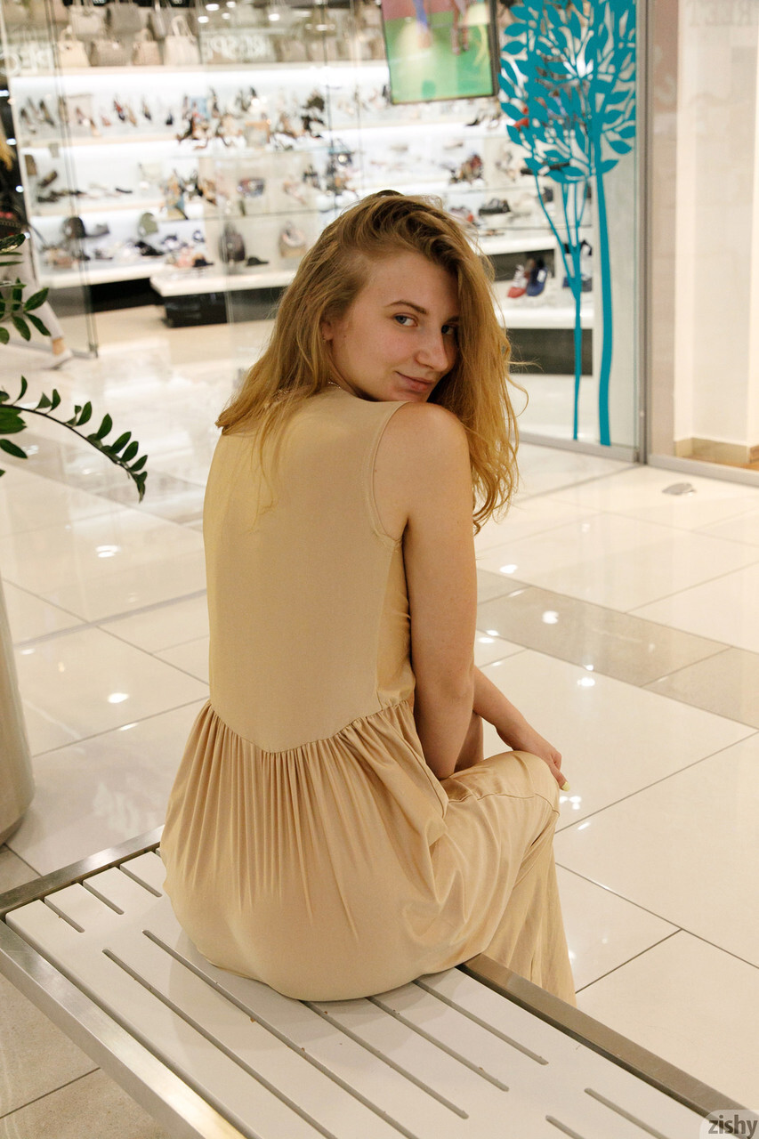 Ukrainian babe Regan Budimir flashes her big tit while posing at the mall