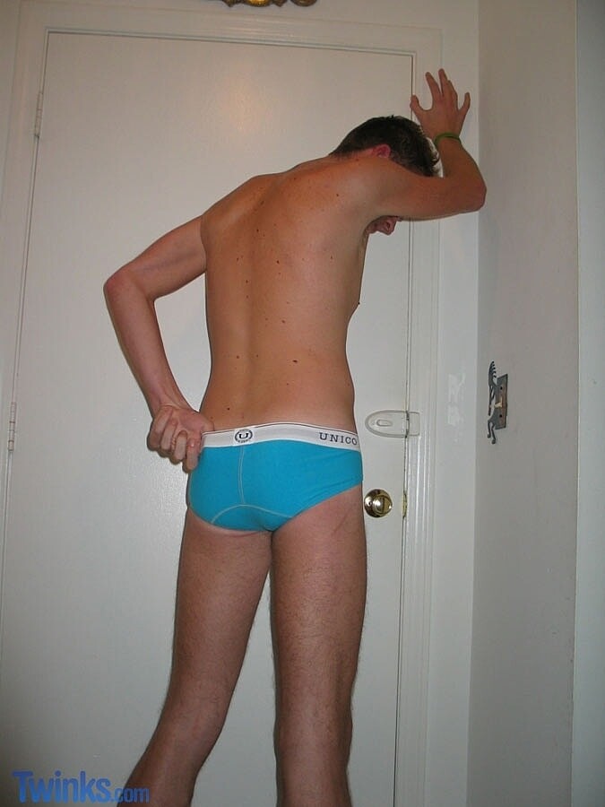 Horny twink jerks his hairy dick while standing until he ejaculates