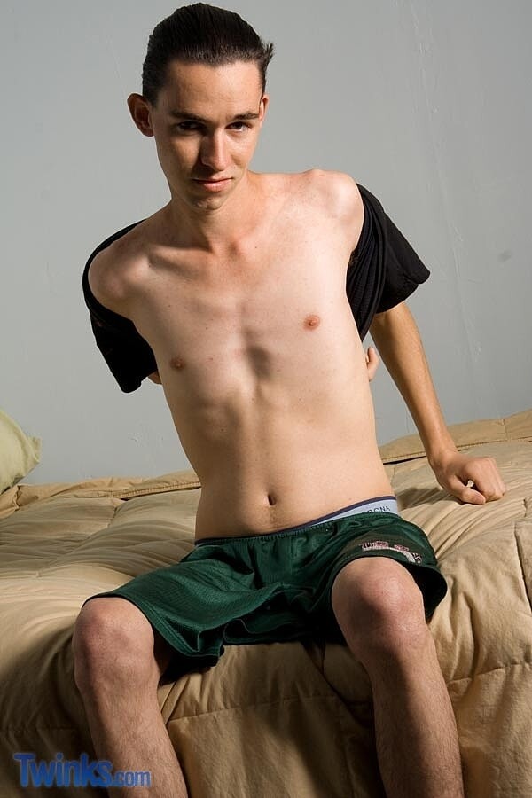 Skinny gay boy Tim O stripping and jerking off on the bed in a solo