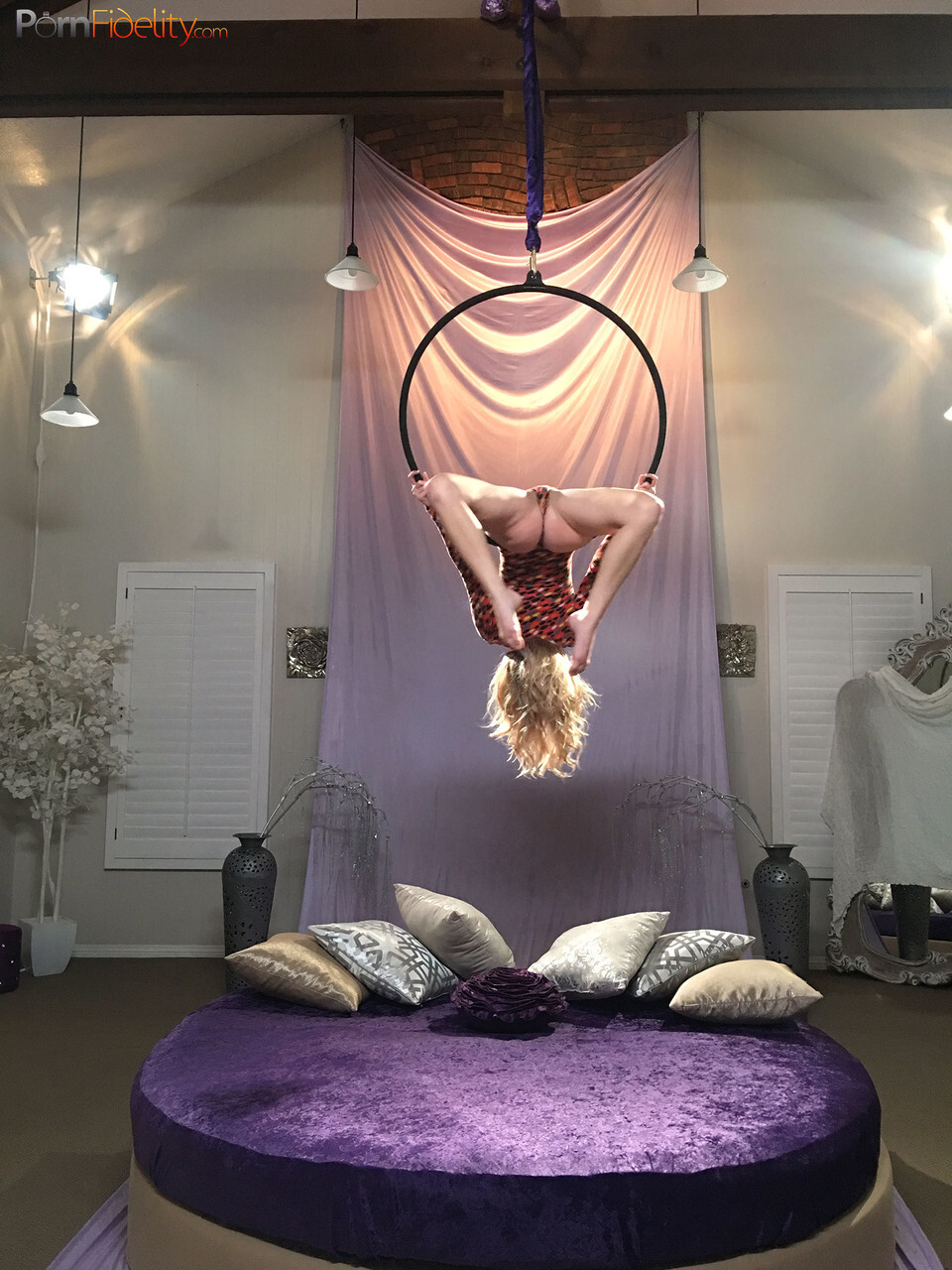 Superb blonde doll Arya Fae doing aerial yoga and showing her tits and ass