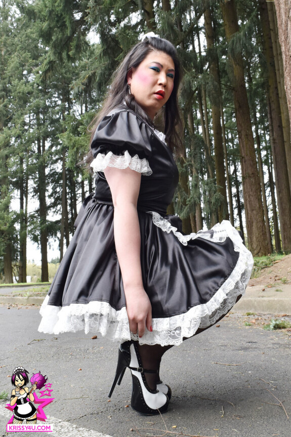 Dirty Asian shemale in a maid dress flashes her ass in the park