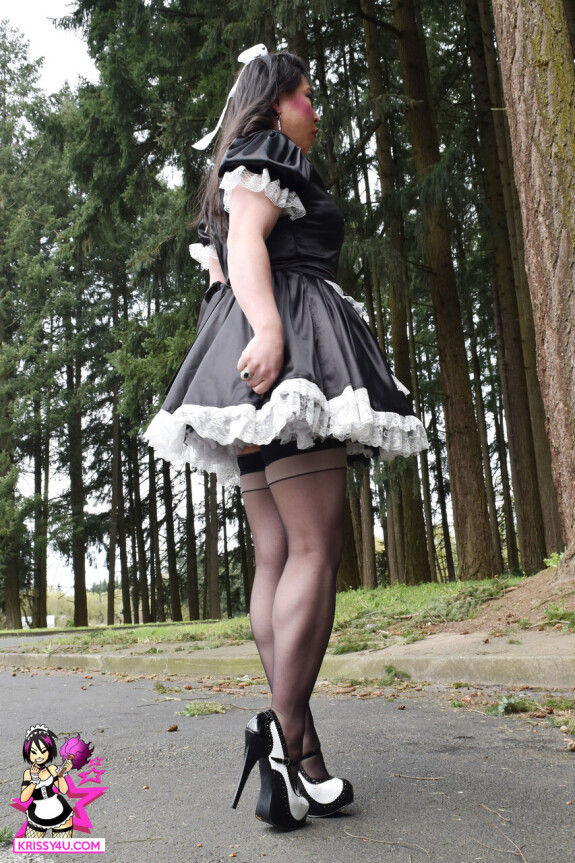 Dirty Asian shemale in a maid dress flashes her ass in the park