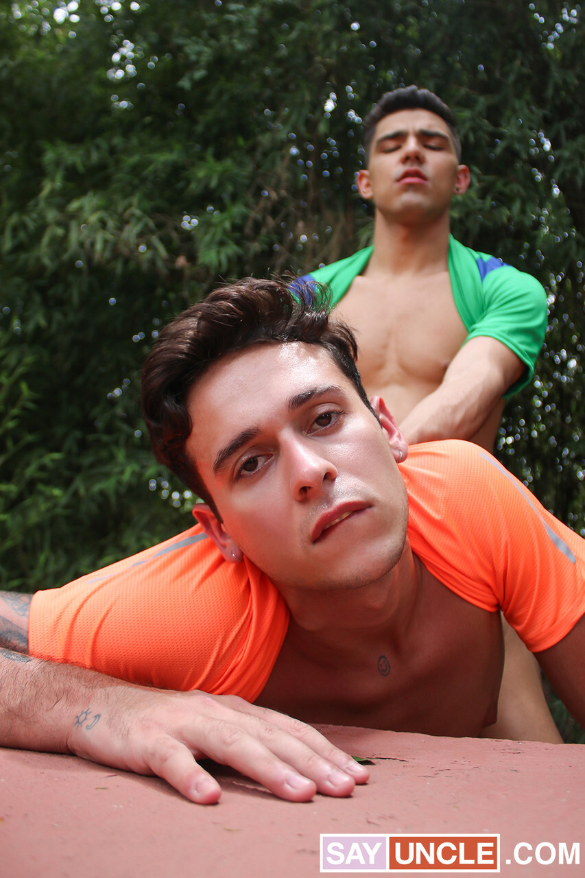 Three twink pornstars doff their football shorts and fuck bareback withinside the woods