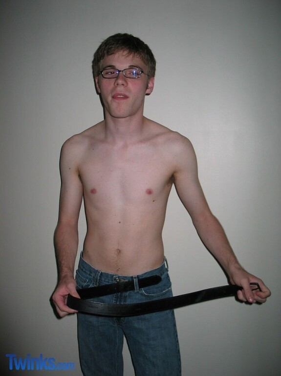 Nerdy twink Billy Gee loses his shirt and jeans and jerks off his massive dick