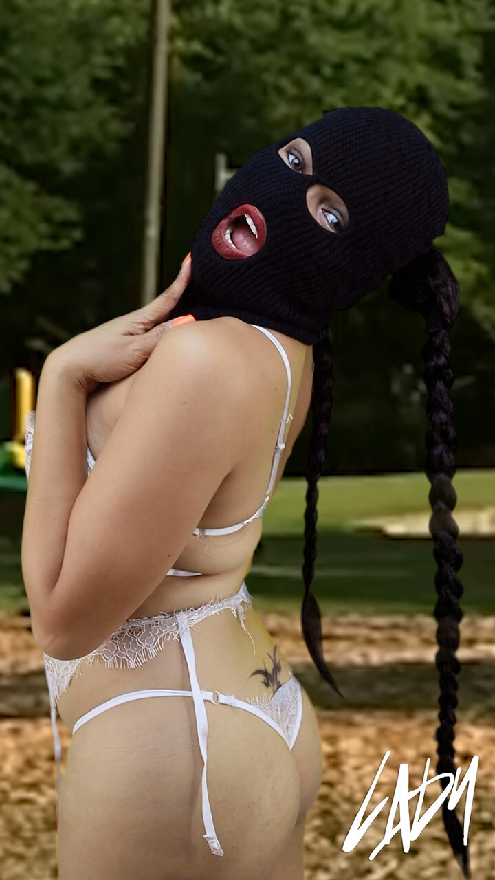 Masked brunette shemale flaunting her big ass andamp; tits in her lingerie outside