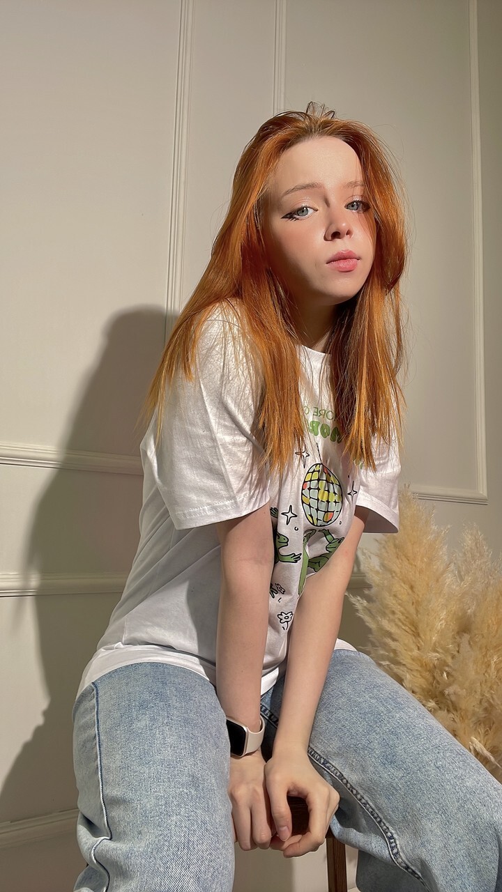 Redheaded OnlyFans teen Olash Peachy posing in her kinky compilation