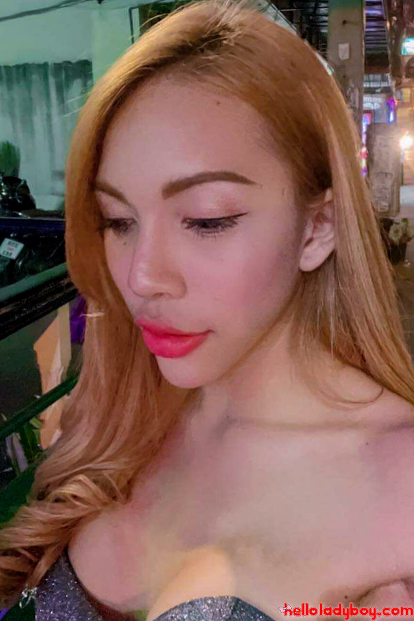 Blue-eyed Asian ladyboy shows off her alluring figure and poses provocatively