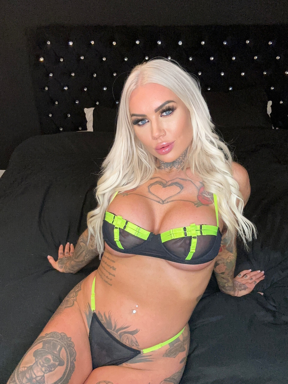 OnlyFans bombshell Megan Loux displays her curvy inked body in a solo