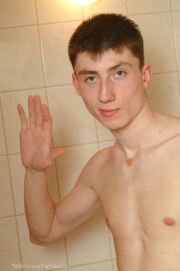 Petite skinny twink doffs his clothes and gets wet in a foamy bathtub