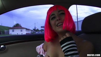 Beauty in purple wig having extensive intercourse withinside the automobile