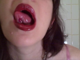 Adorable splendor in red panties demonstrates her pierced tongue