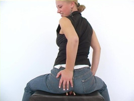 Working female in tight denims suggests the capabilities of her butt