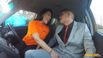 Quick blowjob at Fake Driving School through a busty brunette