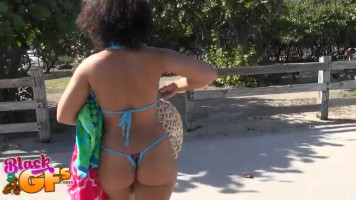 Sporty busty ebony Ava Sanchez poses at the beach