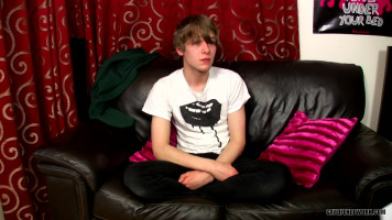 Pasty-searching twink boy jerking his cock on a leather-based sofa