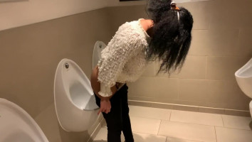 London Sweetie makes use of Urinal in Mens Lavatory