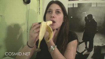 Sensual Cosmid mademoiselle is ingesting a banana in a warm manner