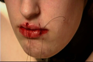 The insane BDSM health practitioner is attempting to make her mouth even smaller