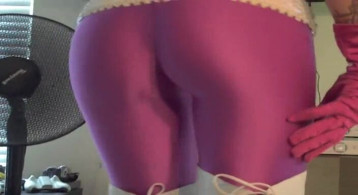 Sweetest splendor in purple spandex tights is mendacity at the mattress