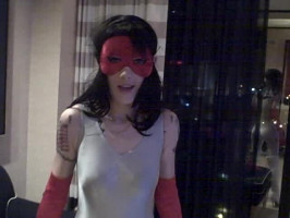 Masked spandex lady indicates off her attractive slim frame