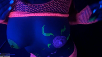 Neon female Nikki Sims paints on her big nipples