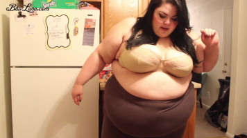 Black-haired BBW Luna demonstrates her frame in brown pants