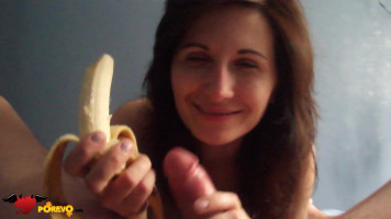 Dark-haired female is ingesting banana and blowing a dick