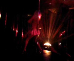 Elegant lengthy-legged lady is dancing in miniskirt withinside the night time club