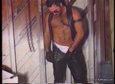 Brutal male in leather-based pants squeezing his tough dick