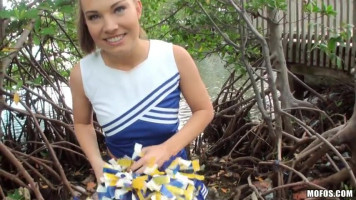 Sweet smiling brunette Cheerleader is acting an awesome blowjob!