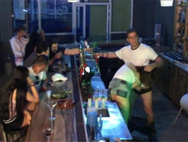 Horny bartender is fucking a busty kinky brunette on the bar stand