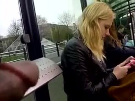 Crazy man is displaying his dick for a blonde on the bus station