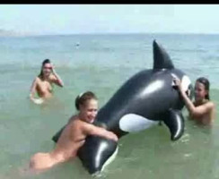 Three loopy narrow teens are posing bare on the general public beach