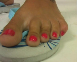 Amazingly candy babe is having tattooed soles and pink nails