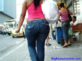 Brunette in red t-blouse have a spherical large booty and tight denims