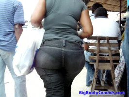 Very candy large ass in tight black denims in close-up