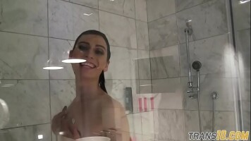 Smalltitted tranny showering while filmed