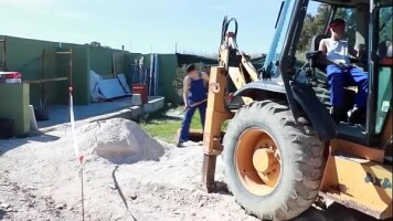 Two guys fuck on a construction site