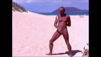 Tanned man on seashore in tiny string thong (temporarily!)