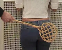 Young ass spanked with a carpet dirt beater