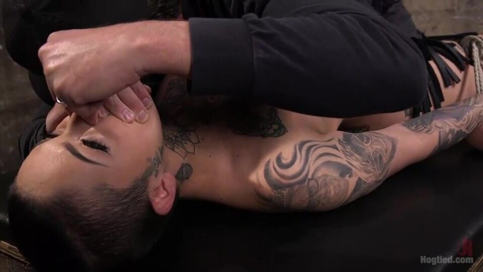 Bound tattooed splendor is getting strangled and pussy fingered