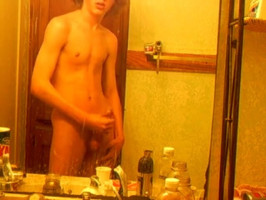 Curly-haired twink in bathroom